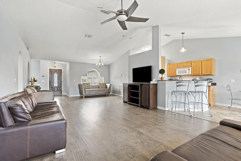 Great room with vaulted ceiling open to kitchen at 11197 Illford Dr