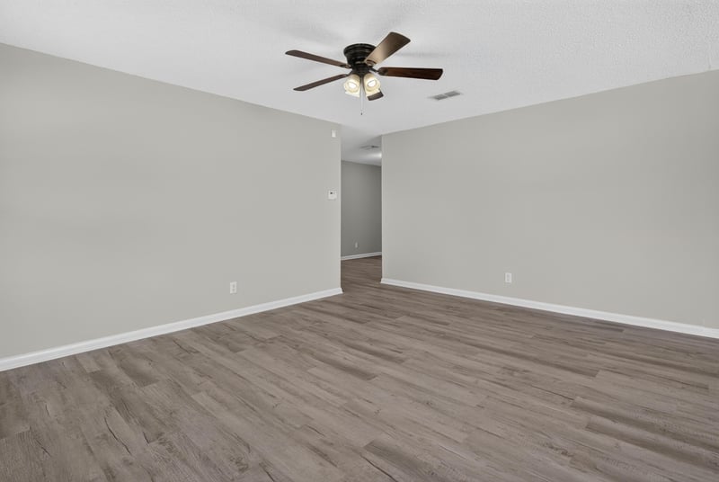 Open room with wood-look flooring at 5503 Boeing Dr, Jacksonville, FL 32207