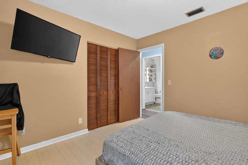 Bedroom with closet and wall-mounted television at 3249 Maryland Ave, Green Cove Springs, FL