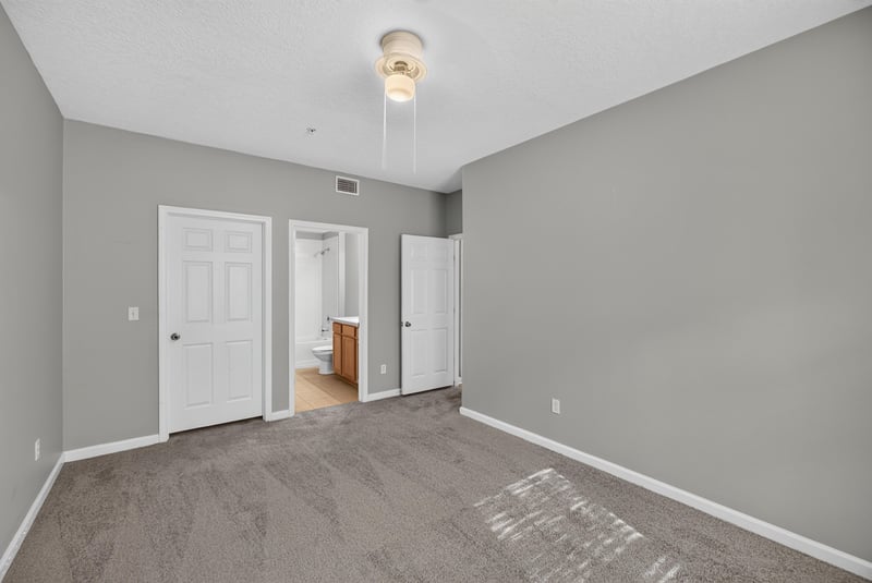 Bedroom with closet and entry doors at 575 Oakleaf Plantation Pkwy, Orange Park, FL 32065