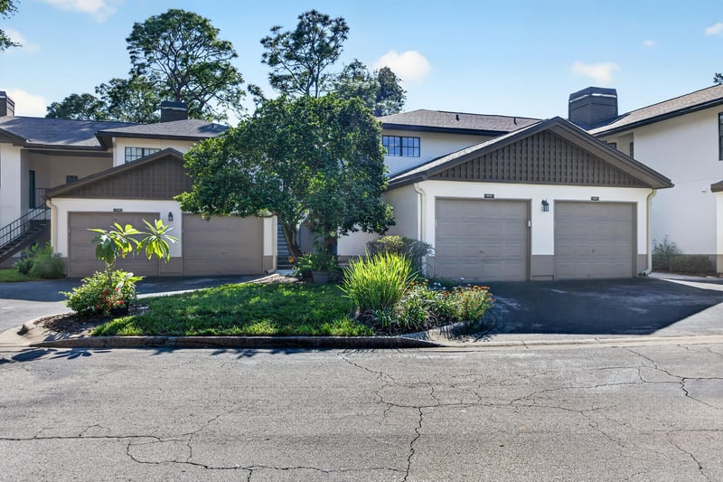 Condo building with attached garages and driveway at 10150 Belle Rive Blvd, Jacksonville, FL