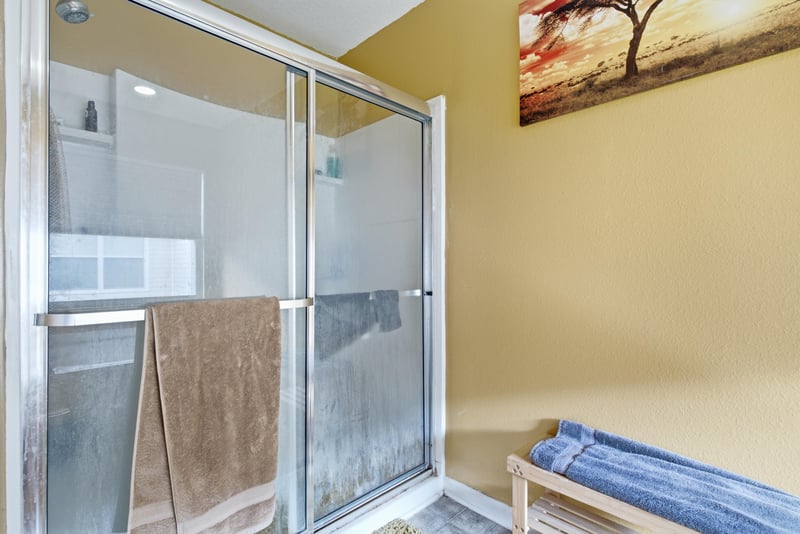 Primary bathroom with glass shower stall at 7392 Timber Falls Ct