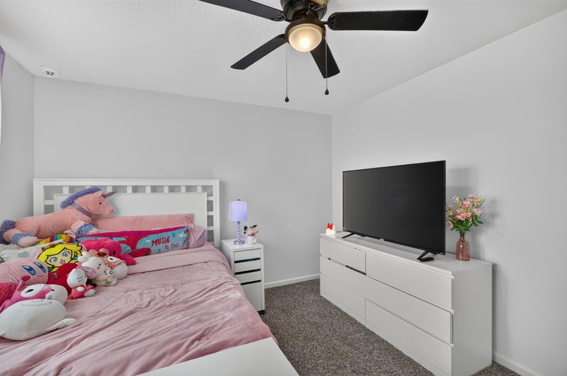 Bedroom with bed and dresser at 65255 Frst Glen Ln, Yulee, FL 32097
