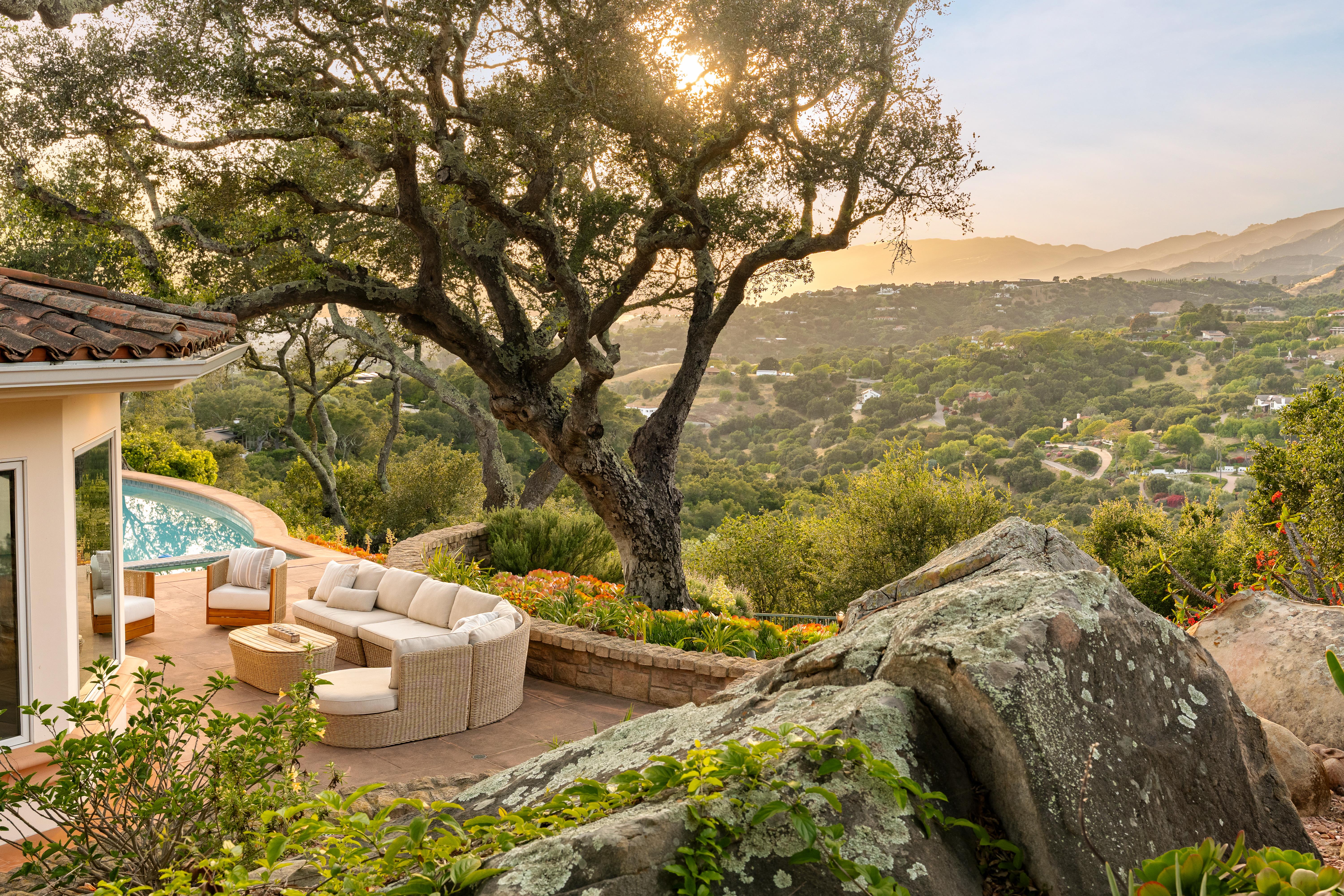 Exterior facade of luxury estate at 450 El Cielito Rd, Santa Barbara — professional real estate photography showcasing Santa Ynez Mountain views and architectural detail along the Santa Barbara Riviera. Our team captured still photography, aerial drone photography, twilight photography, a Matterport virtual tour, a 2D floor plan, and a custom property website from afternoon through twilight.