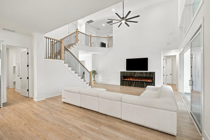 Great room sectional with fireplace and TV at 907 Seagrove Dr, Ponte Vedra Beach, FL 32081