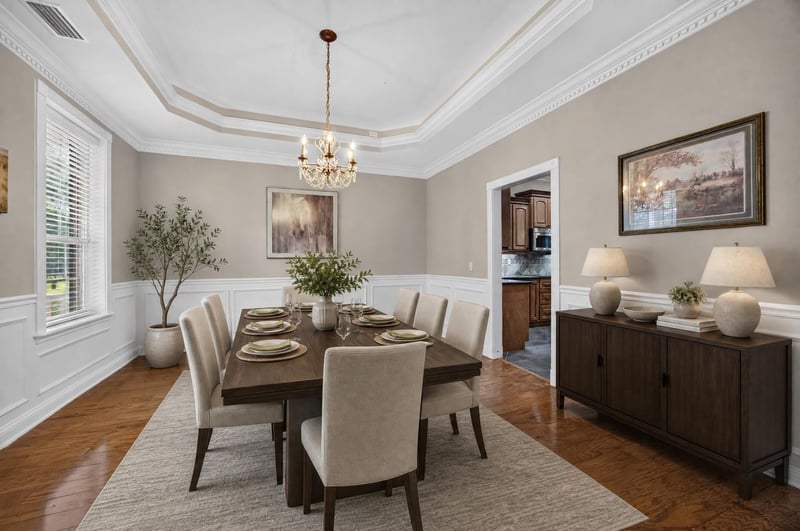 Dining room staged with table and chandelier at 1735 Hagans Ridge Ct