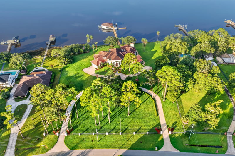 Aerial view of the home amid lawn and trees at 344 Broward Rd, Jacksonville, FL