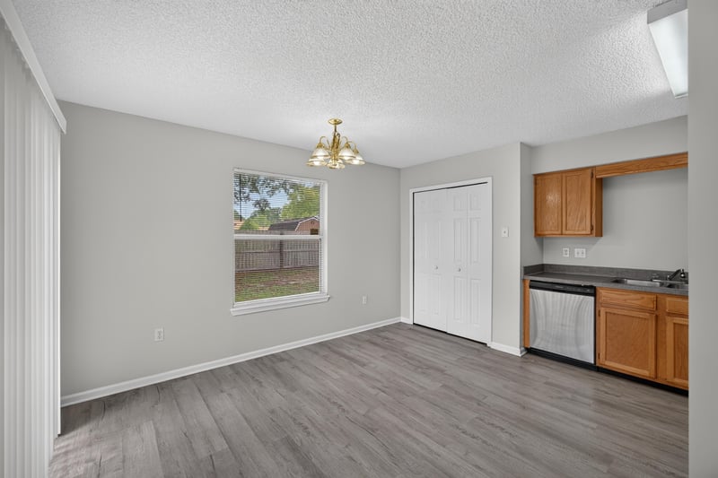 Dining area with window and kitchen entry at 8519 Blazing Star Ct, Jacksonville, FL 32210