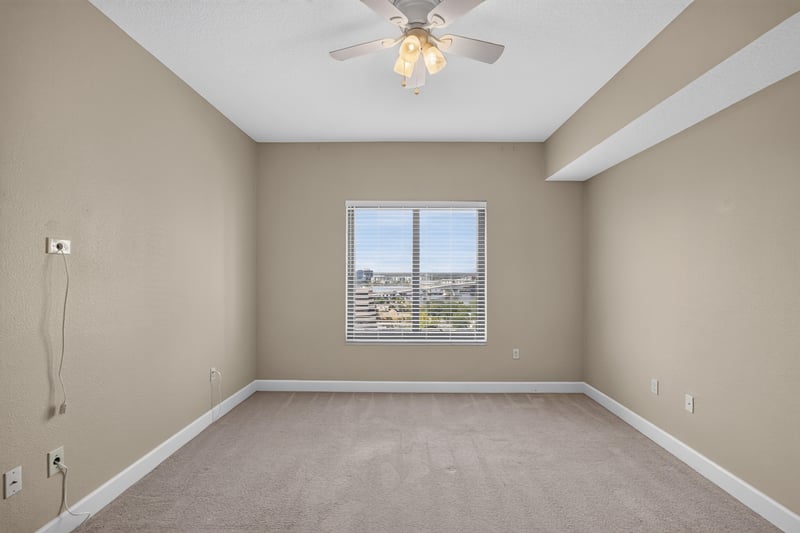 Bedroom with ceiling fan and window at 1478 Riverplace Blvd 1904, Jacksonville, FL 32207