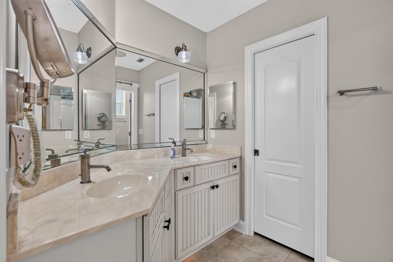 Bathroom with double vanity at 117 Island Cottage Way, St. Augustine, FL 32080