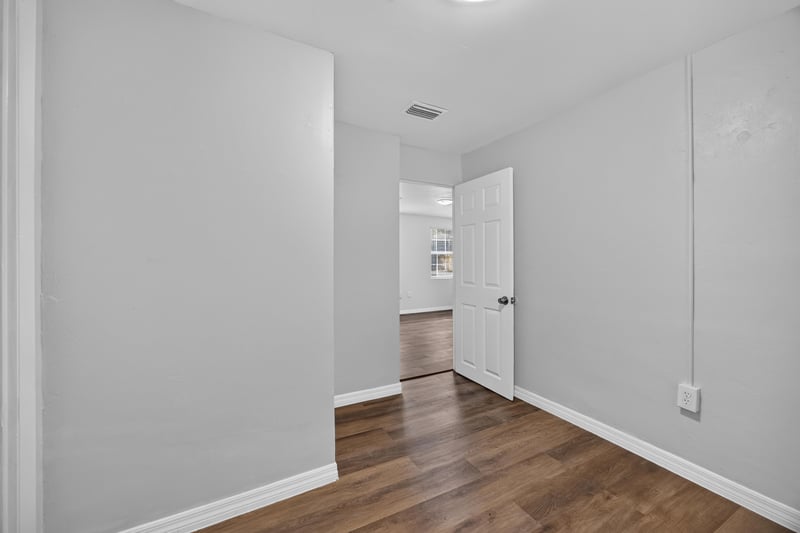 Hallway with wood flooring at 4951 Halls Dr