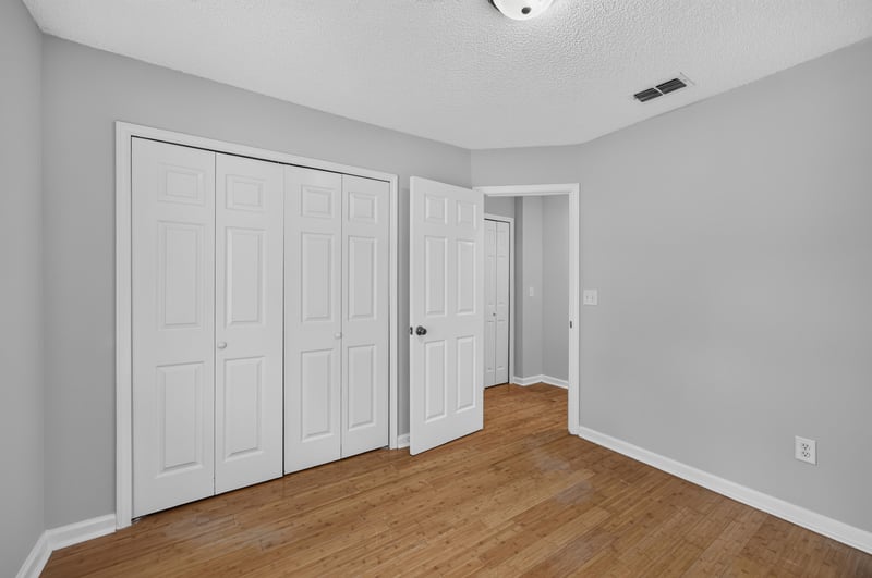 Bedroom closet with sliding doors at 456 Bay Point Way N, Jacksonville, FL 32259
