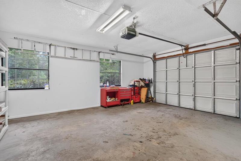 Garage interior with storage and overhead lighting at 3249 Maryland Ave, Green Cove Springs, FL