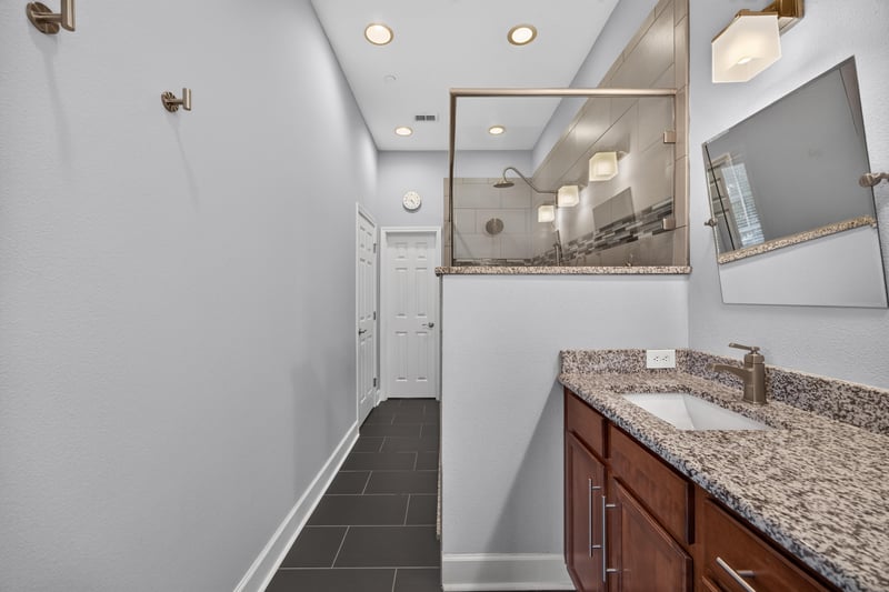 Primary bathroom vanity with granite counter at 6217 Eclipse Cir, Jacksonville, FL 32258