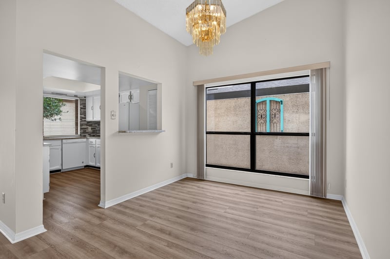 Room adjoining kitchen with sliding glass door at 3407 Fairbanks Grant Rd N, Jacksonville, FL 32223