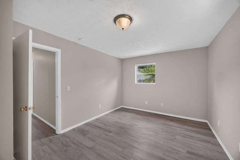 Empty room with window and wood-look flooring at 1083 Stokes St, Jacksonville, FL