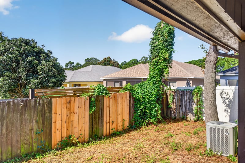 Backyard with wood fence at 8010 International Village Dr, Jacksonville, FL 32277