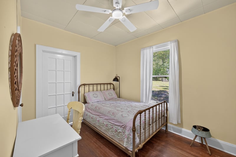 Bedroom with surfboard decor and bed at 101 N Lake St, Crescent City, FL