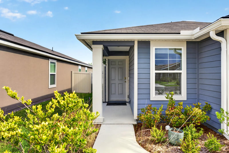 Covered front porch and entry door at 4276 Quaking St, Jacksonville, FL 32218
