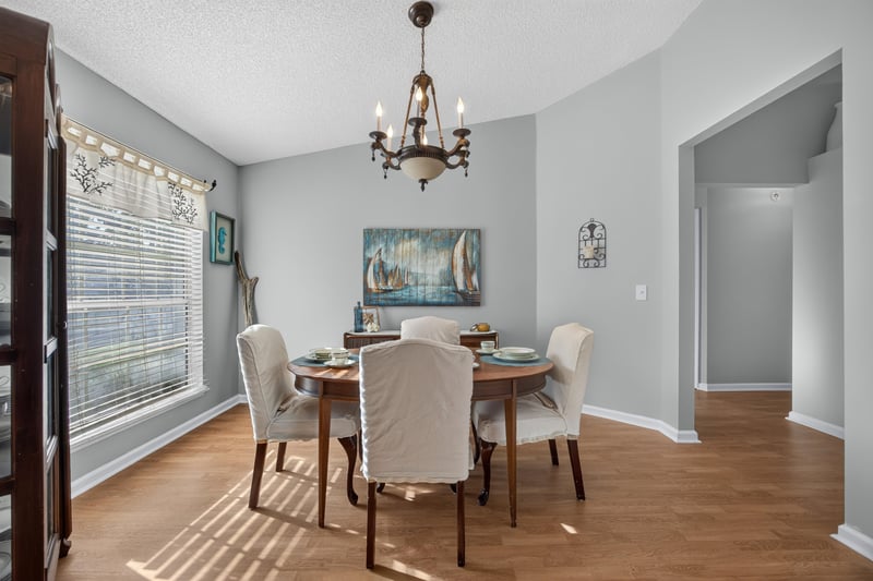 Dining room with round table and chandelier at 4556 Shaky Leaf Ln N, Jacksonville, FL 32224