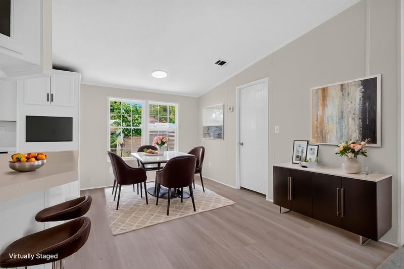 Dining area staged with table and buffet at 7603 Coach Park Dr, Jacksonville, FL 32244