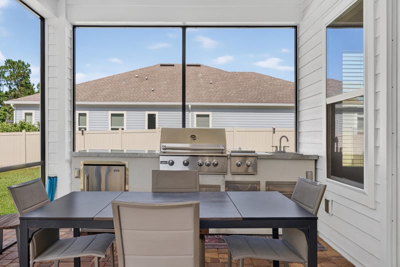 Outdoor kitchen with grill and patio at 22 Azura Point