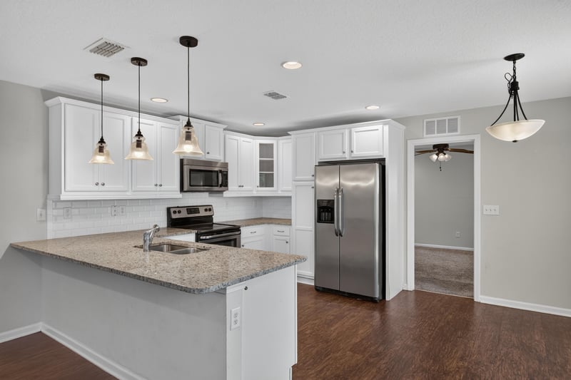 Kitchen with stainless appliances and pendant lighting at 1002 Ingleside Ave, Jacksonville, FL 32205