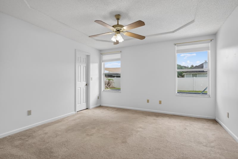 Bedroom with carpet and windows at 2164 Orangewood St, Middleburg, FL 32068