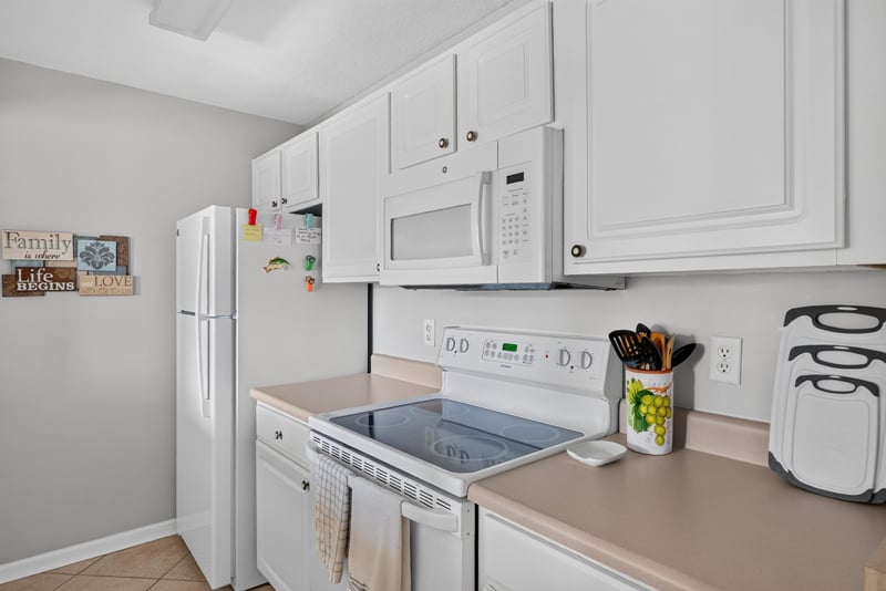 Kitchen counter with microwave and cabinets at 206 16th St, St. Augustine, FL 32080