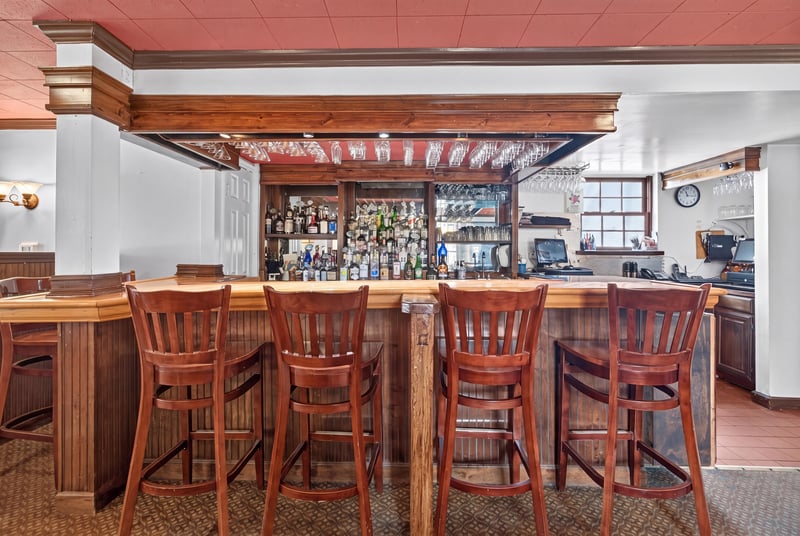 Bar seating under exposed wood beams at 115 Cordova St, St. Augustine, FL