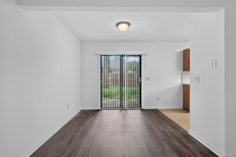 Living area with sliding door to backyard at 1445 Classic Oak Rd W, Jacksonville, FL
