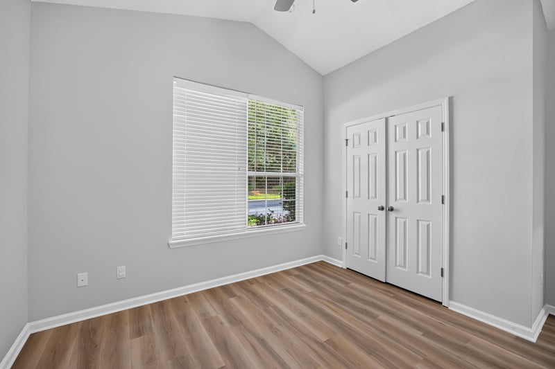 Secondary bedroom with closet doors at 3101 E Banister Rd, St. Augustine, FL 32092