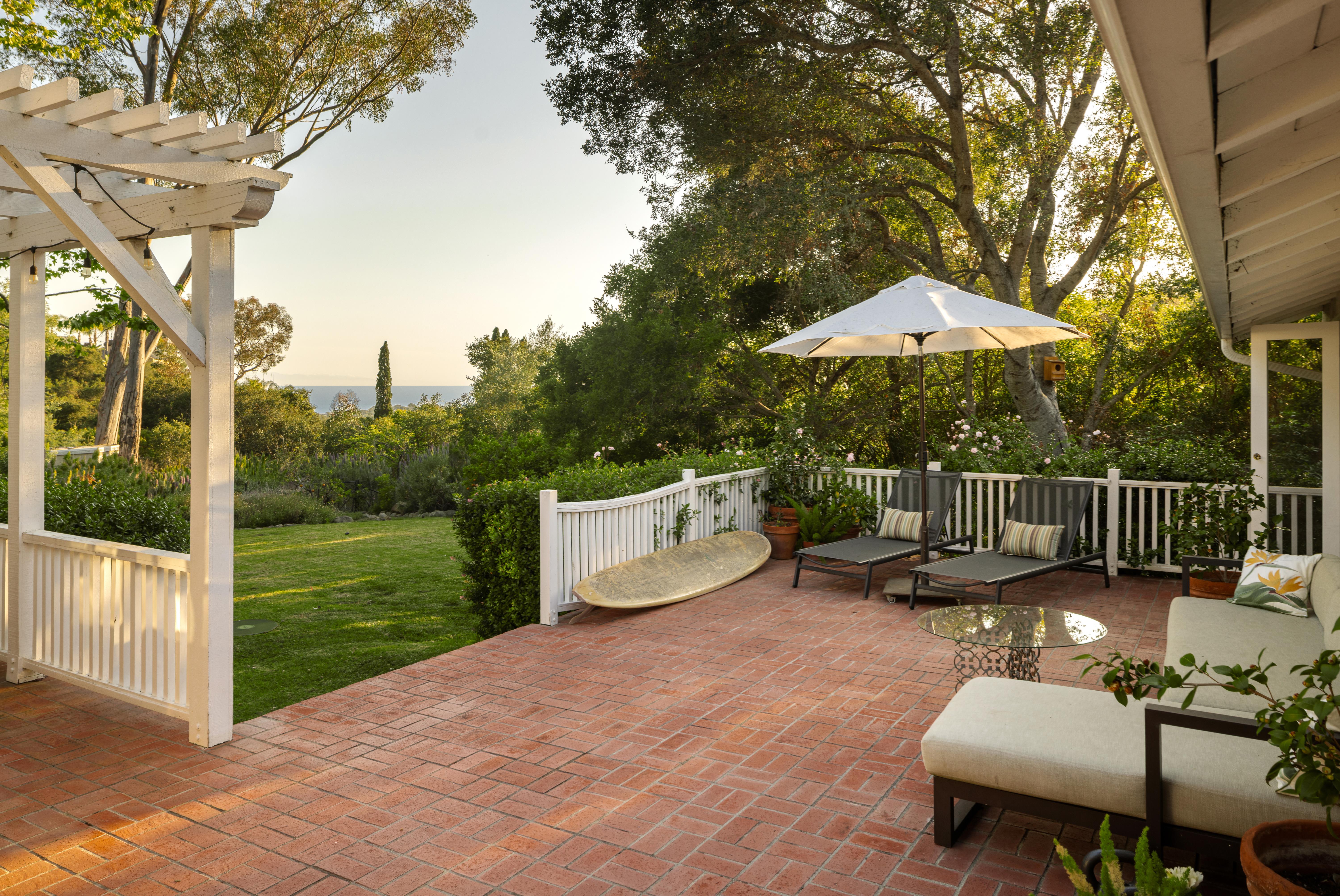 Aerial drone photography of 2915 Hidden Valley Ln, Santa Barbara CA — sweeping elevated perspective reveals the property's relationship to the surrounding Montecito foothills and mature tree canopy in this real estate drone photography series by VirTour Media. Our team captured still photography, aerial drone photography, and twilight photography from late afternoon through twilight.