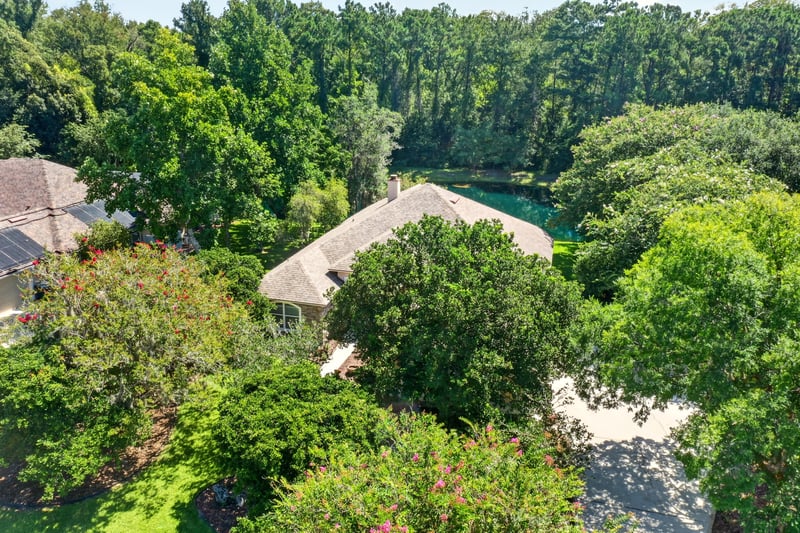 Aerial of the home and pond-front yard at 11675 Magnolia Estates Rd, Jacksonville, FL 32223