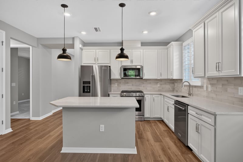 Kitchen with stainless appliances and pendant lighting at 171 Oyster Shell Ter, Nocatee, FL 32081