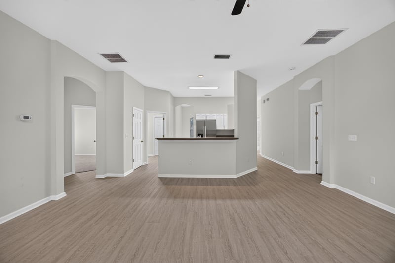 Open floor plan view toward kitchen and hallway at 706 Bonaparte Dr, Jacksonville, FL 32218
