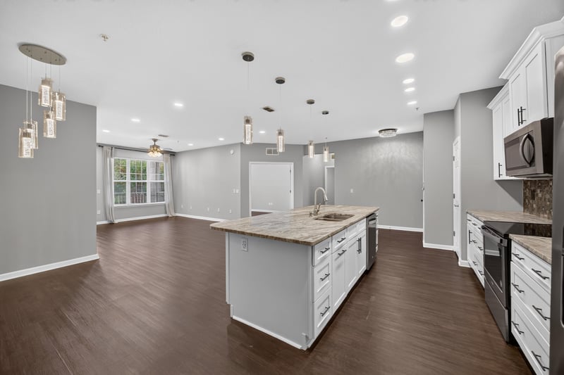 Kitchen island and open living space at 11251 Campfield Dr unit 4209, Jacksonville, FL 32256
