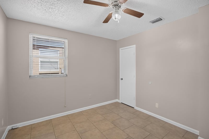 Bedroom with window and closet door at 8067 Parental Cir, Jacksonville, FL 32216