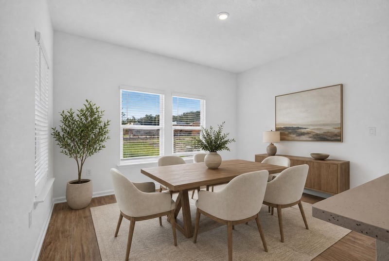 Virtually staged dining room with table and chairs at 269 Bluegrass Wy, St. Augustine, FL 32092