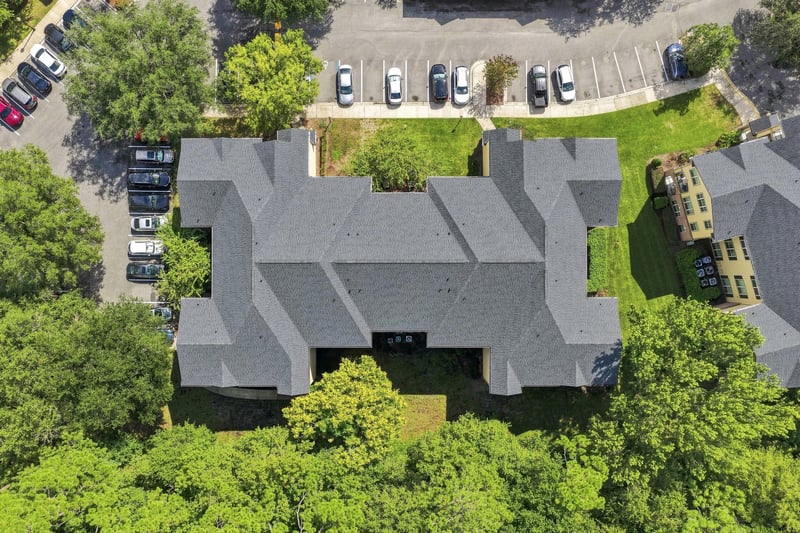 Aerial view of the condo building and parking lot at 7800 Point Meadows Dr, Jacksonville, FL 32256
