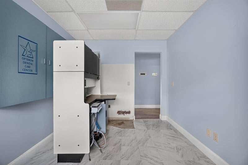 Room with built-in cabinet and adjoining doorway at 1543 Kingsley Ave #19, Orange Park, FL 32073
