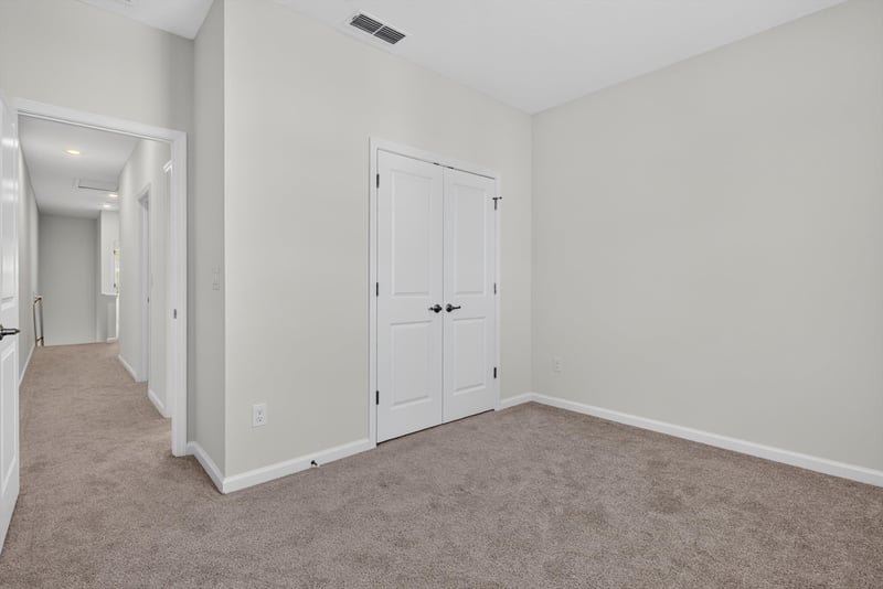 Hallway with closet doors at 39 Mellowood Ln, St. Augustine, FL 32092