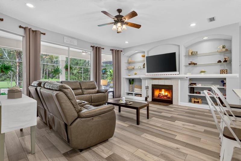 Living room with fireplace and built-in shelving at 2304 Spring Hill Ct, Orange Park, FL