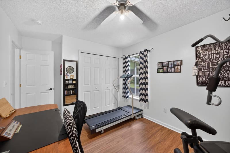 Home gym with weight bench and treadmill at 13514 Las Brisas Way N, Jacksonville, FL