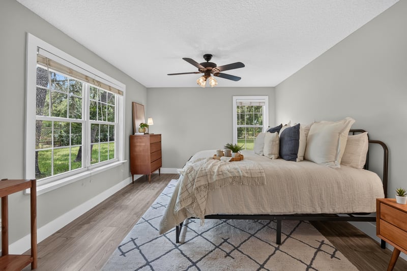 Bedroom with dresser and large window at 1161 Whispering Pines Rd, Jacksonville, FL 32259