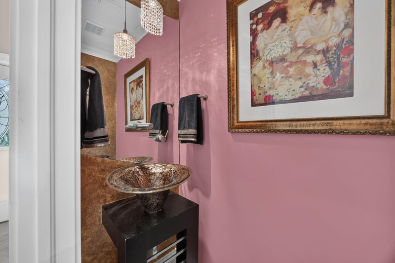 Bathroom detail with vessel sink and artwork at 117 Island Cottage Way, St. Augustine, FL 32080