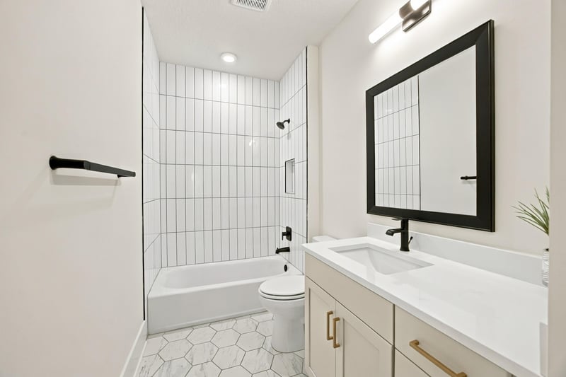 Bathroom with tub and glass shower at 907 Seagrove Dr, Ponte Vedra Beach, FL 32081