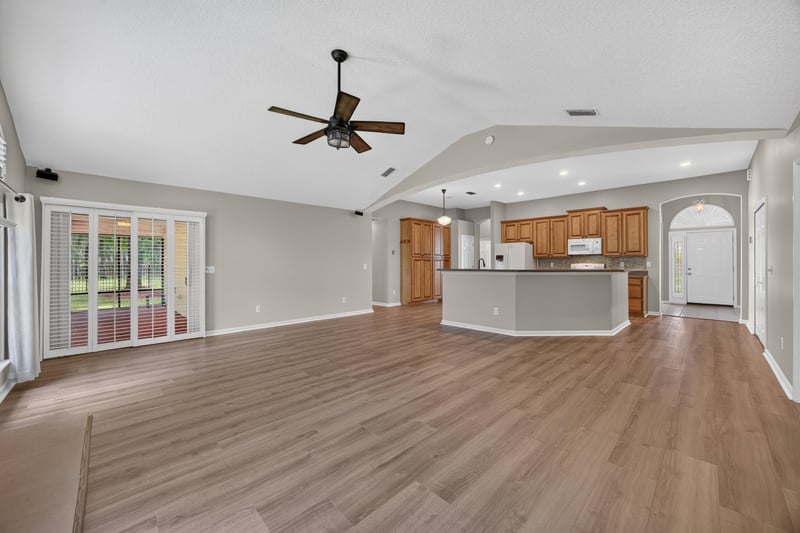 Living room open to the kitchen at 1955 GUARDED Way, Fleming Island, FL 32003