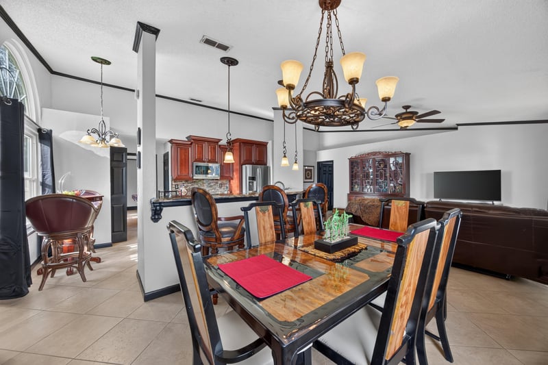 Dining room with kitchen bar stools at 6931 Cane Grass Ln E, Jacksonville, FL 32244
