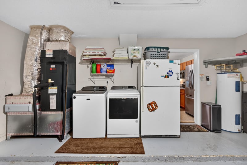Laundry room with storage shelves at 1589 Backwater Drive, Middleburg, FL 32068